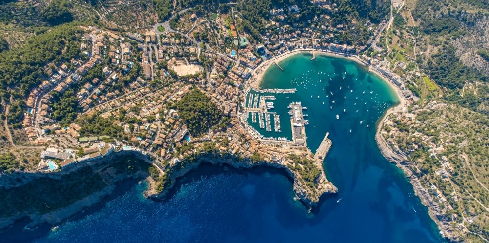 Aerial image Port de Soller - Water surface at the bay along the sea coast of Balearic Sea in Port de Soller in Balearic Islands, Spain