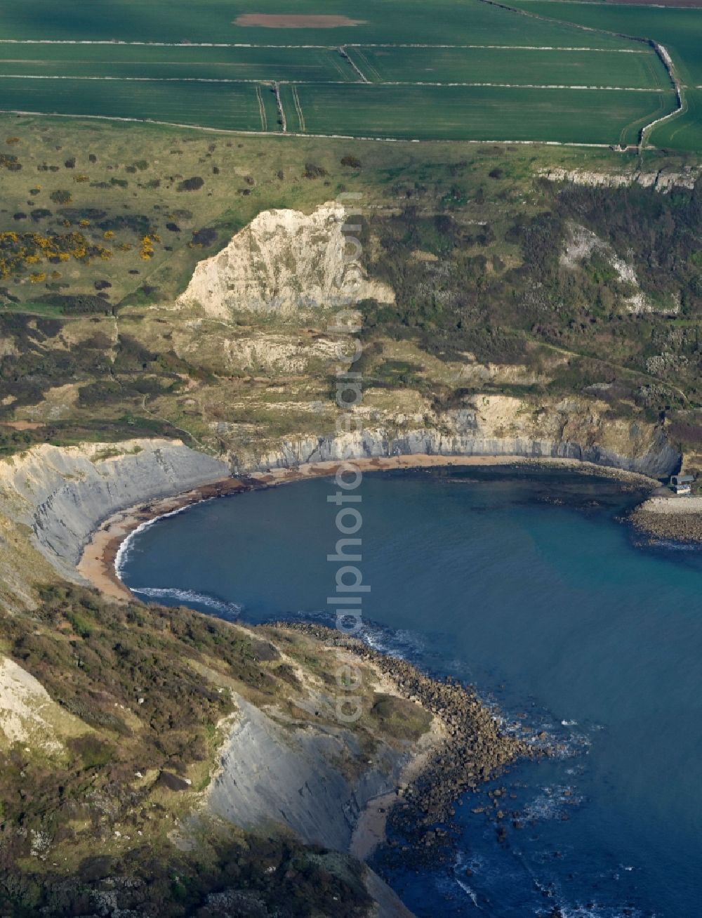 Worth Matravers from above - Water surface at the bay along the sea coast of English Channel Chapman's Pool in Worth Matravers in England, United Kingdom