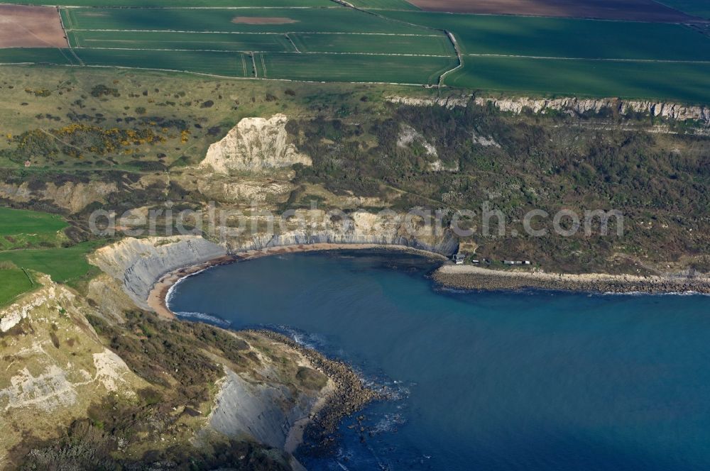Worth Matravers from the bird's eye view: Water surface at the bay along the sea coast of English Channel Chapman's Pool in Worth Matravers in England, United Kingdom
