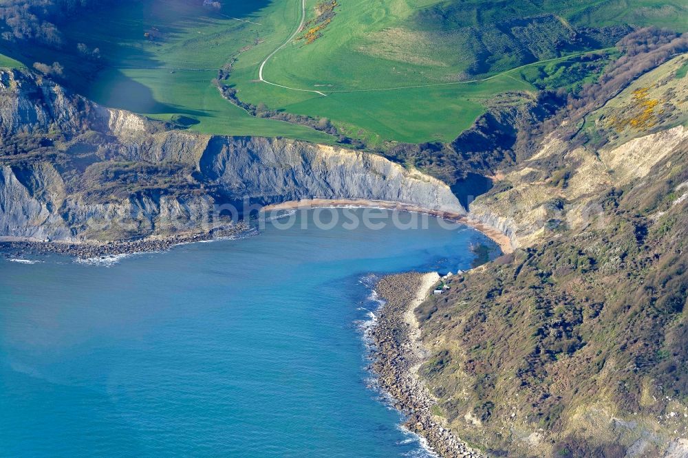 Worth Matravers from the bird's eye view: Water surface at the bay along the sea coast of English Channel Chapman's Pool in Worth Matravers in England, United Kingdom