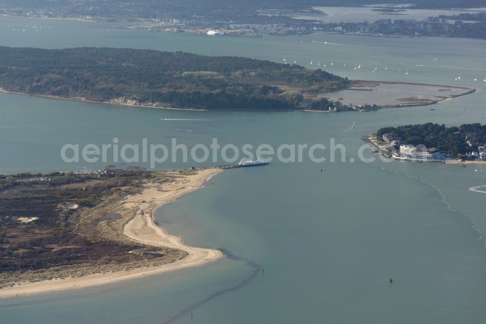 Poole from the bird's eye view: Water surface at the seaside Poole Harbour of English Channel Brownsea Island in Poole in England, United Kingdom