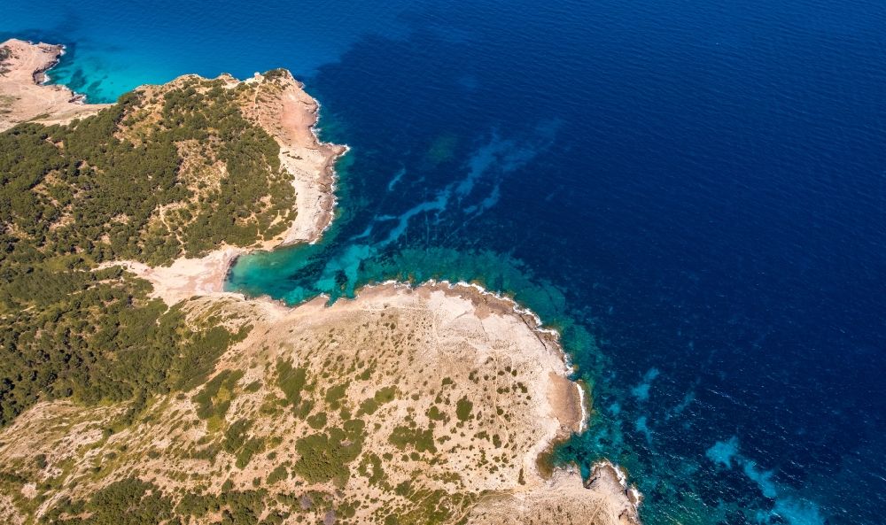 Aerial photograph Arta - Water surface at the seaside at the beach Cala Matzoc in Arta in Balearic island of Mallorca, Spain
