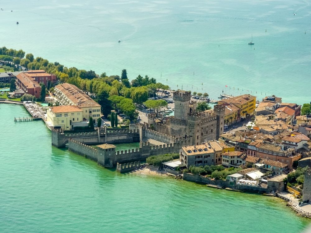 Sirmione from above - Building of water castle Scaligerburg - Castello Scaligero on the headland Sirmione in Lombardia, Italy