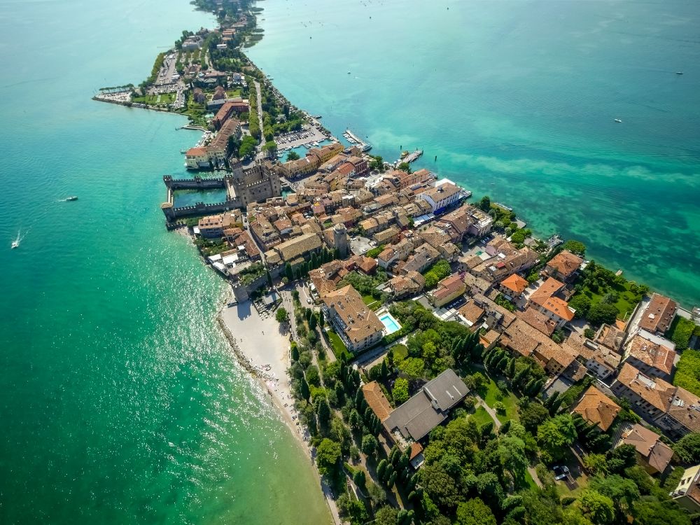 Sirmione from the bird's eye view: Building of water castle Scaligerburg - Castello Scaligero on the headland Sirmione in Lombardia, Italy