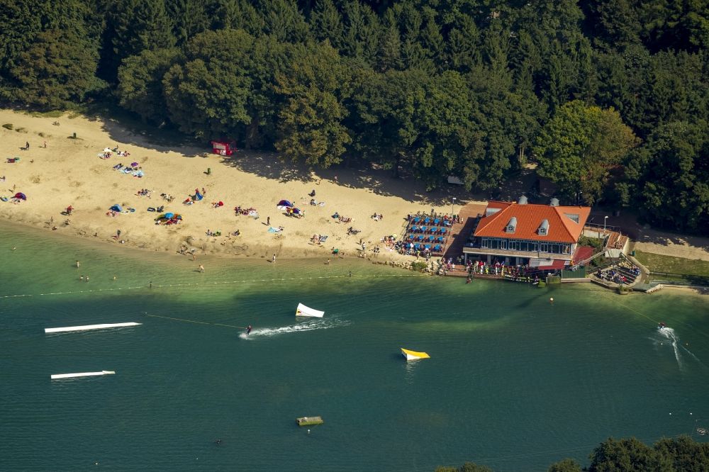 Haren Ems from the bird's eye view: The waterski facility of the holiday resort Schloss Dankern in front of the beach of Dankern Lake in Haren (Ems) in the state Lower Saxony. On the beach you can see people bathing