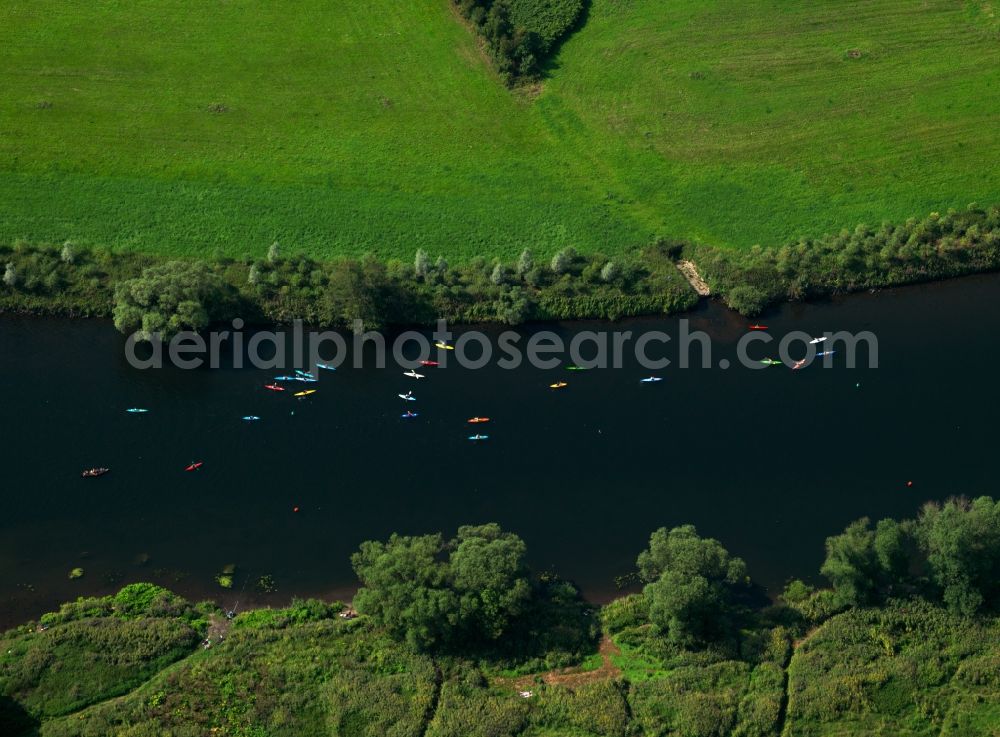 Aerial image Wickede (Ruhr) - Rowing and canoeing on the river Ruhr in the borough of Wickede in the state of North Rhine-Westphalia. The rowers and kayaks are moving along a quiet part of the Ruhr region river, surrounded by meadows