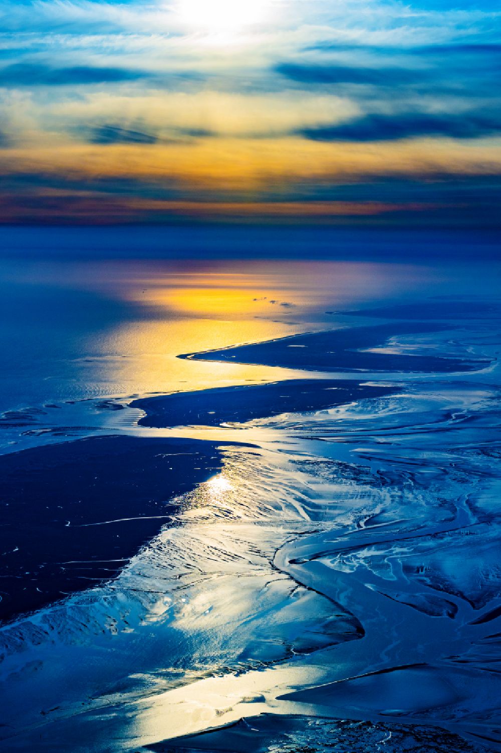 Baltrum from the bird's eye view: Wadden Sea of North Sea Coast at sunrise in Baltrum in the state Lower Saxony, Germany
