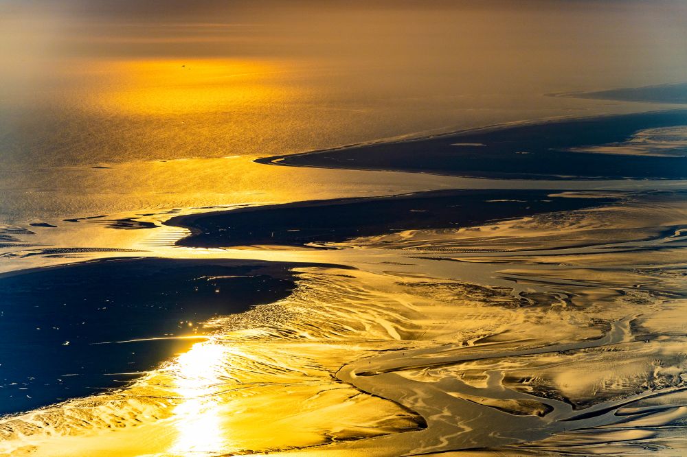 Baltrum from the bird's eye view: Wadden Sea of North Sea Coast at sunrise in Baltrum in the state Lower Saxony, Germany
