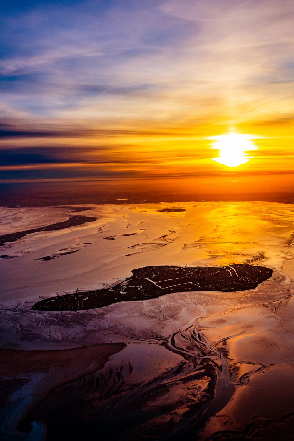 Aerial image Hooge - Wadden Sea of the North Sea coast in Hallig Hooge at sunrise in the state Schleswig-Holstein, Germany