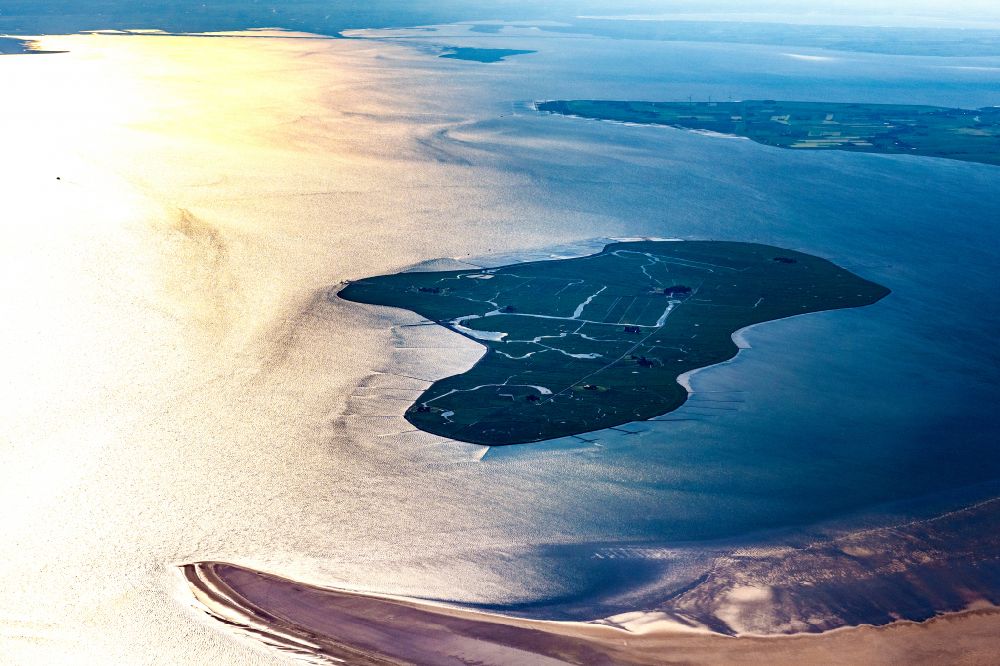 Hooge from above - Wadden Sea of the North Sea coast in Hallig Hooge at sunrise in the state Schleswig-Holstein, Germany