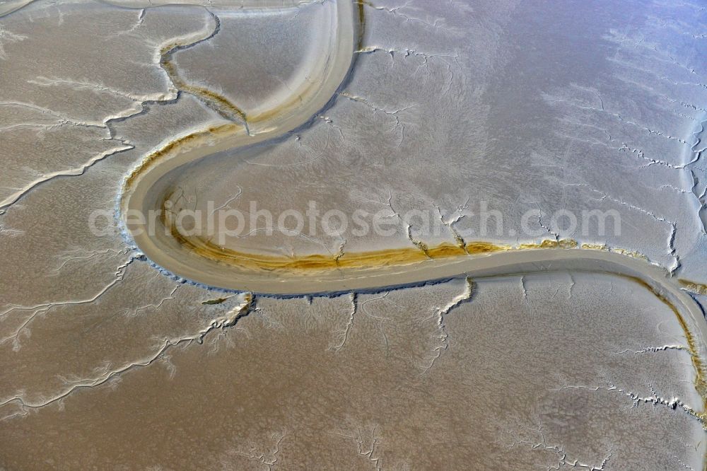 Dangast from the bird's eye view: Wadden Sea with the low-water bed of the extension of the Jade Bay Dangaster low on the North Sea coast in the state of Lower Saxony Dangast