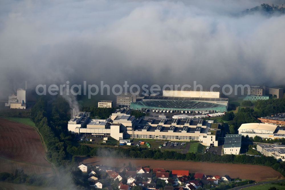 Melsungen from the bird's eye view: Building and production halls on the premises of B. Braun Melsungen AG, factory Pfieffewiesen in the district Adelshausen in Melsungen in the state Hesse, Germany