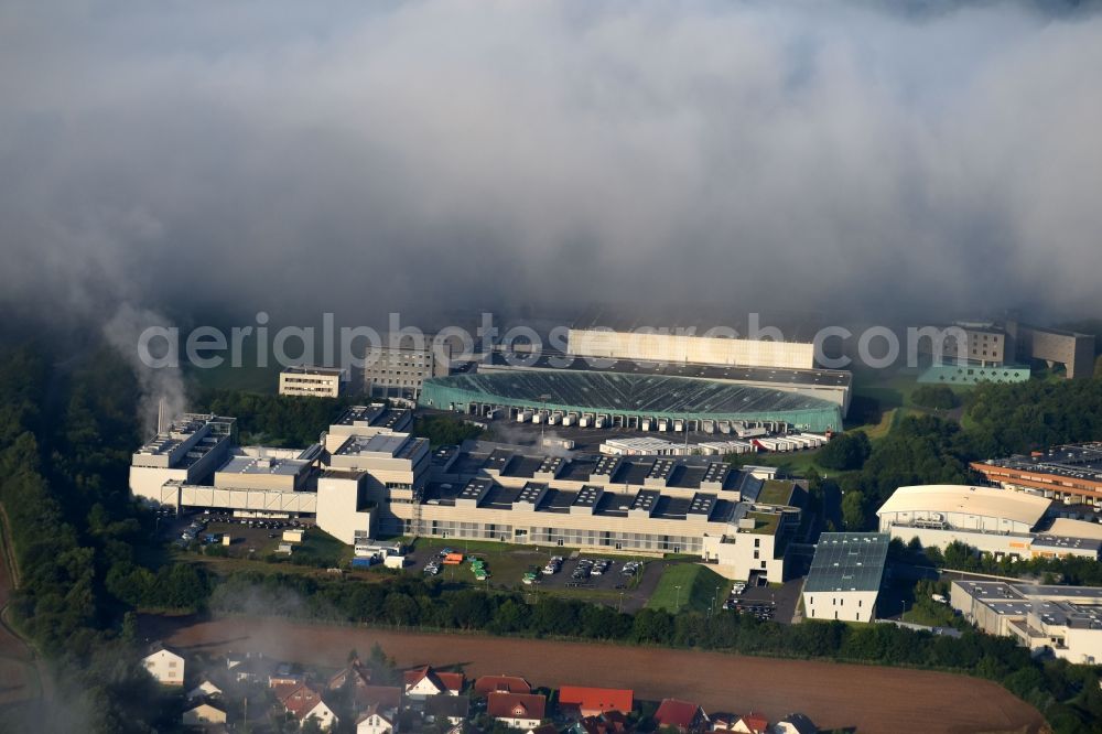 Aerial image Melsungen - Building and production halls on the premises of B. Braun Melsungen AG, factory Pfieffewiesen in the district Adelshausen in Melsungen in the state Hesse, Germany