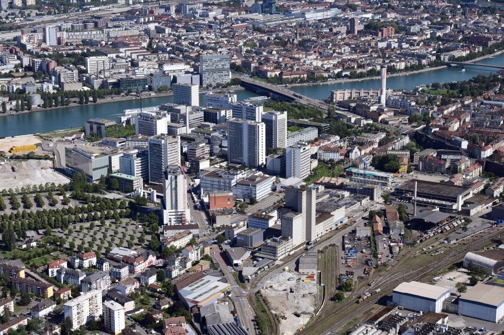 Basel from above - Buildings and production halls on the factory premises of pharmaceutical company Novartis in Basel in Switzerland. The Novartis Campus is located in the district of St. Johann and is global headquarter of the pharmaceutical giant with its centre for Research, Development and Management. The buildings are designed by well-known architects