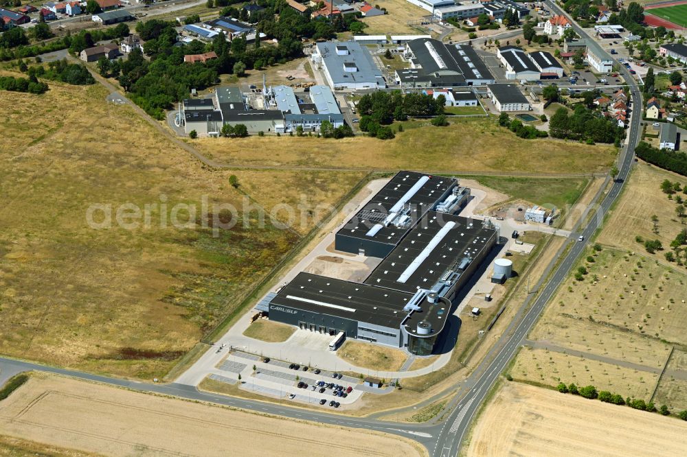 Waltershausen from the bird's eye view: Building and production halls on the premises of CARLISLE Construction Materials GmbH on street Gothaer Strasse in Waltershausen in the state Thuringia, Germany