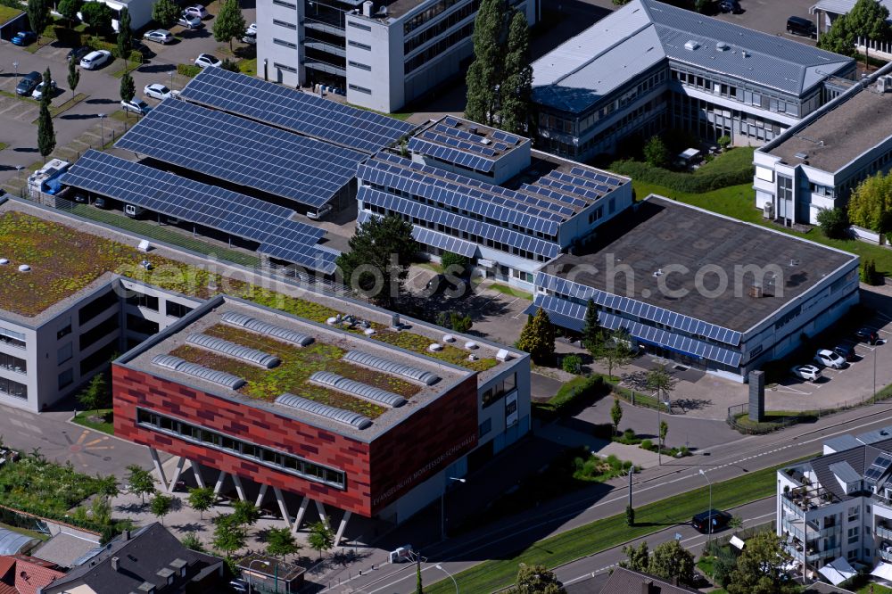 Aerial photograph Freiburg im Breisgau - Buildings, production halls and covered car parking spaces with photovoltaic systems from the company Z-LASER GmbH on Merzhauser Strasse in Freiburg im Breisgau in the state Baden-Wuerttemberg, Germany