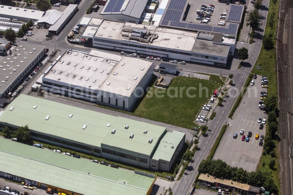Aerial image Villach - Building and production halls on the premises of Henelit Lackfabrik GmbH on Seebacher Allee in Villach in Kaernten, Austria