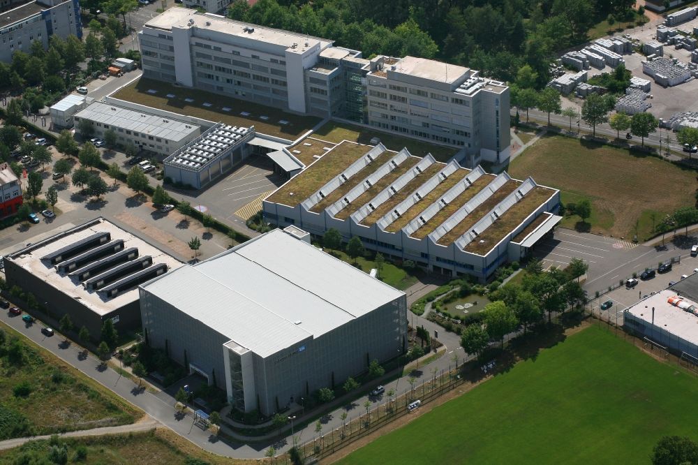 Weil am Rhein from the bird's eye view: Buildings and halls on the premises of measurement and control company Endress and Hauser in the district Friedlingen in Weil am Rhein in the state Baden-Wurttemberg
