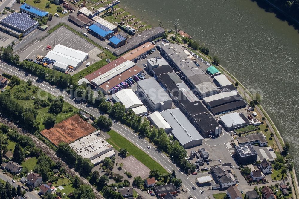 Neckarsteinach from the bird's eye view: Building and production halls on the premises of Odenwald-Chemie GmbH on Hirschhorner Strasse in Neckarsteinach in the state Hesse, Germany