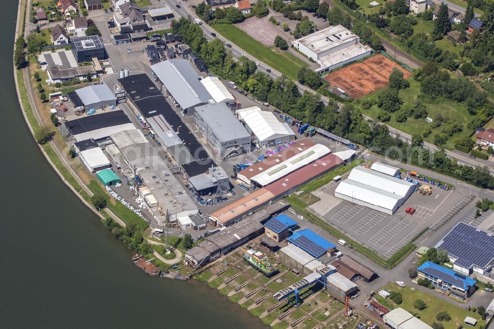 Aerial photograph Neckarsteinach - Building and production halls on the premises of Odenwald-Chemie GmbH on Hirschhorner Strasse in Neckarsteinach in the state Hesse, Germany