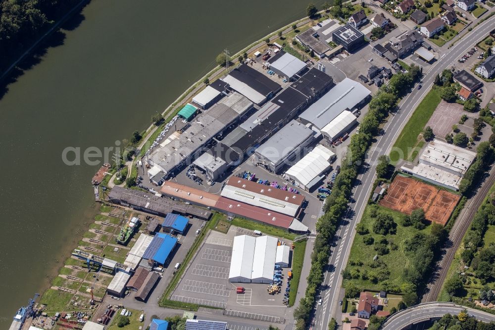 Neckarsteinach from above - Building and production halls on the premises of Odenwald-Chemie GmbH on Hirschhorner Strasse in Neckarsteinach in the state Hesse, Germany