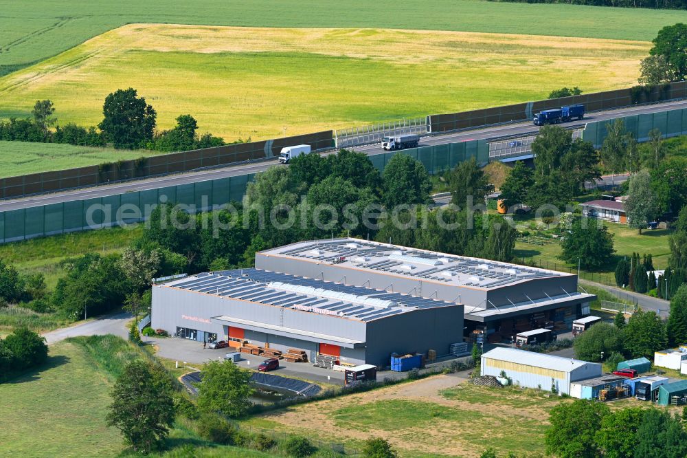 Oberkrämer from the bird's eye view: Building and production halls on the premises of Parkett Hinterseer GmbH Am Elsgraben in Oberkraemer in the state Brandenburg, Germany