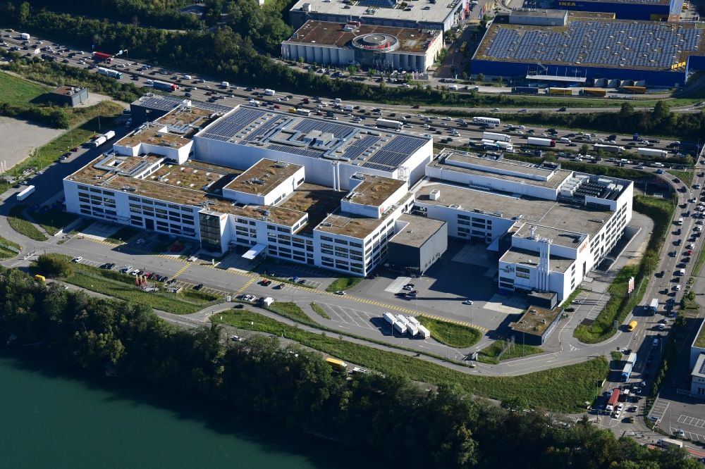 Pratteln from the bird's eye view: Building and production halls on the premises of the production plant of Coop in Pratteln in the canton Basel-Landschaft, Switzerland