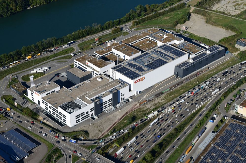 Pratteln from above - Building and production halls on the premises of the production plant of Coop in Pratteln in the canton Basel-Landschaft, Switzerland