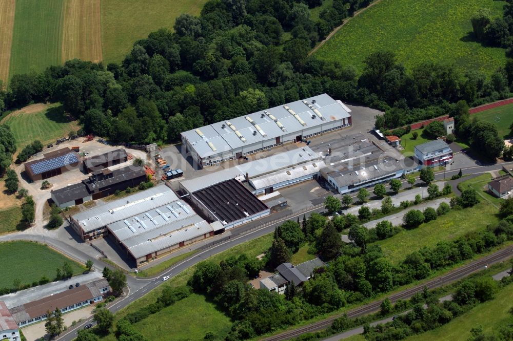 Aerial photograph Münnerstadt - Building and production halls on the premises of REMOG - Rudolf-Erich Mueller GmbH & Co KG in Muennerstadt in the state Bavaria, Germany