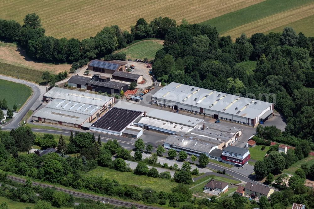 Münnerstadt from above - Building and production halls on the premises of REMOG - Rudolf-Erich Mueller GmbH & Co KG in Muennerstadt in the state Bavaria, Germany