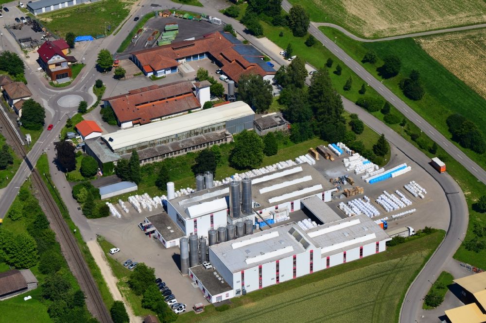 Grießen from above - Building and production halls on the premises of Schaetti GmbH Kunststoff-mahl- factory on Industriestrasse in Griessen in the state Baden-Wuerttemberg, Germany