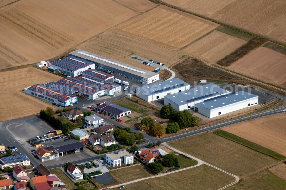 Aerial photograph Steinfeld - Building and production halls on the premises of SCHMELZMETALL Deutschland GmbH and of INHATEC GmbH & Co. KG on Raiffeisenstrasse in the district Hausen in Steinfeld in the state Bavaria, Germany