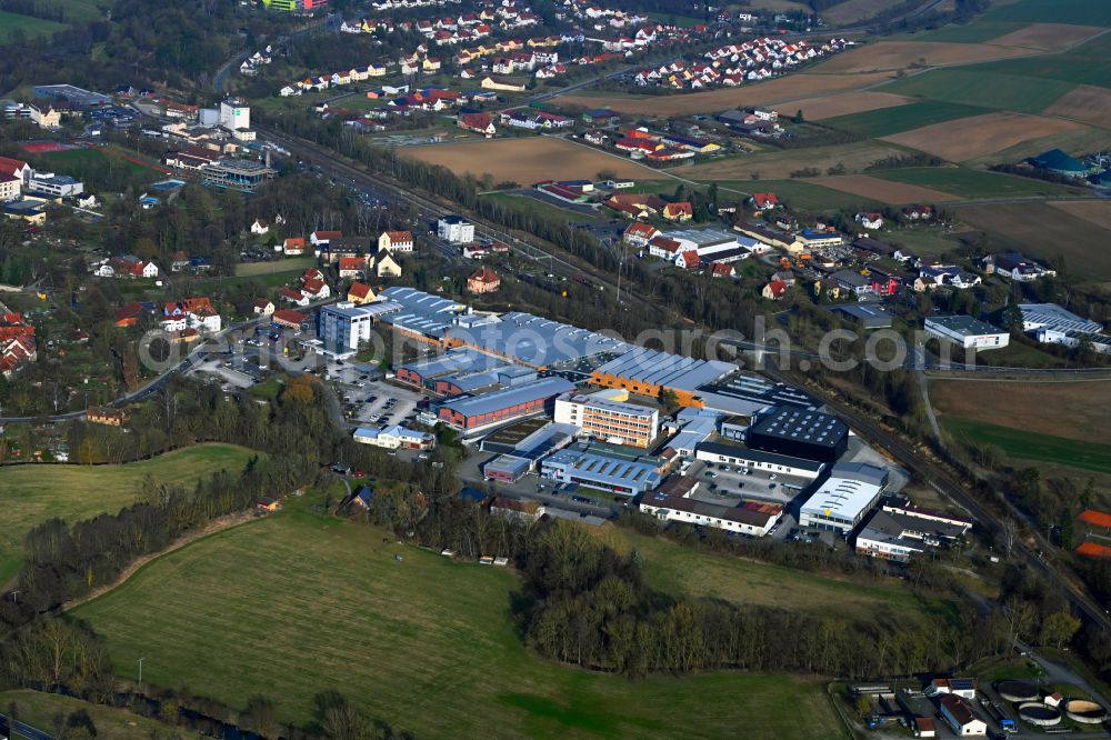 Aerial photograph Mellrichstadt - Buildings and production halls on the factory site for sporting weapons and surface technology of Weihrauch & Weihrauch Sport GmbH & Co. KG on Industriestrasse in Mellrichstadt in the state Bavaria, Germany