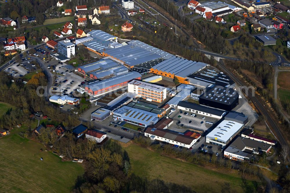 Mellrichstadt from above - Buildings and production halls on the factory site for sporting weapons and surface technology of Weihrauch & Weihrauch Sport GmbH & Co. KG on Industriestrasse in Mellrichstadt in the state Bavaria, Germany