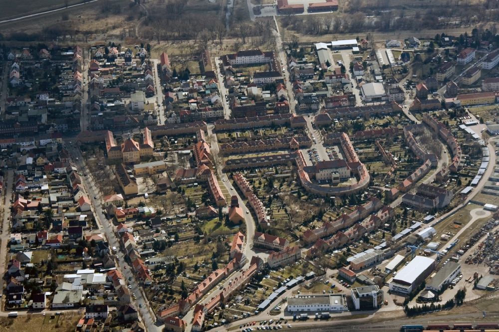 Aerial photograph Wittenberg OT Piesteritz - The Piesteritzer employee housing is the largest car-free housing development in Germany. From 1916 to 1919, the garden city was built to plans by Paul Schmitthenner and Otto Rudolf Salvisberg for about 2000 employees of the adjacent nitrogen plant. It was recorded in 1986 in the list of monuments of the GDR and has since become a historical monument