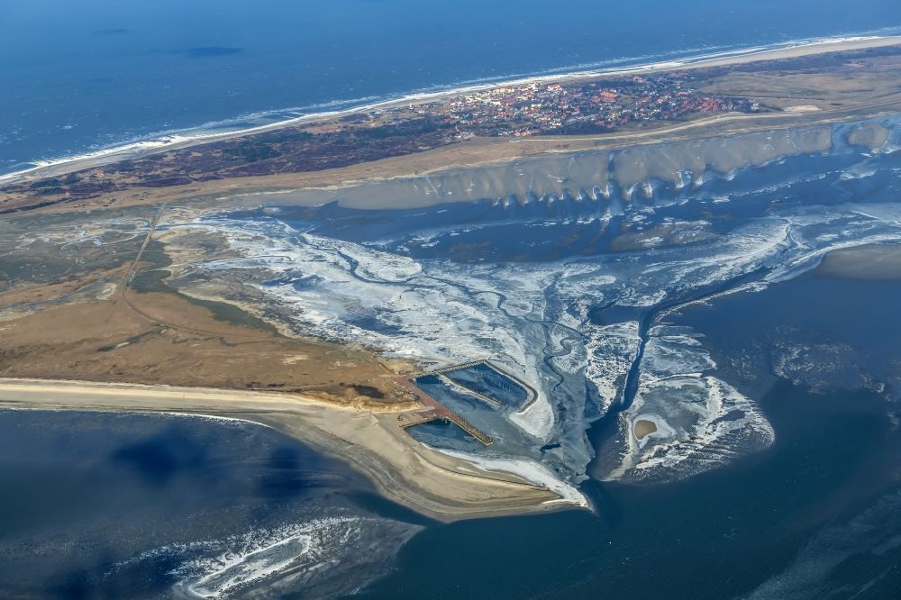 Aerial photograph Wangerooge - Frozen Wangerooges harbor complex, ferry service is no longer possible on the island of Wangerooge in the Wadden Sea in the North Sea in the state of Lower Saxony. Wangerooge is the easternmost of the inhabited East Frisian Islands and has a sandy beach and is North Sea spa