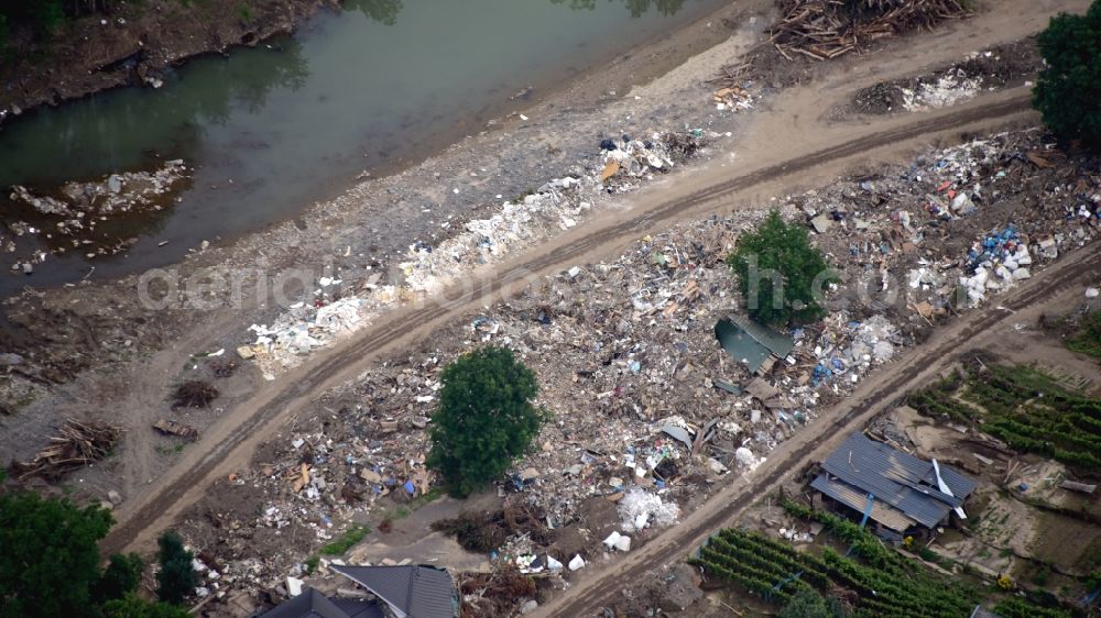 Aerial photograph Bad Neuenahr-Ahrweiler - Western area of Walpozheim after the flood disaster in the Ahr valley this year in the state Rhineland-Palatinate, Germany. Temporary rubbish dumps for temporary storage of floating debris