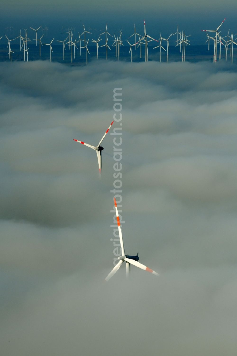 Aerial photograph Waltersdorf - Weather-induced wind energy installations embedded in a fog layer on a field in Waltersdorf in the state Brandenburg, Germany