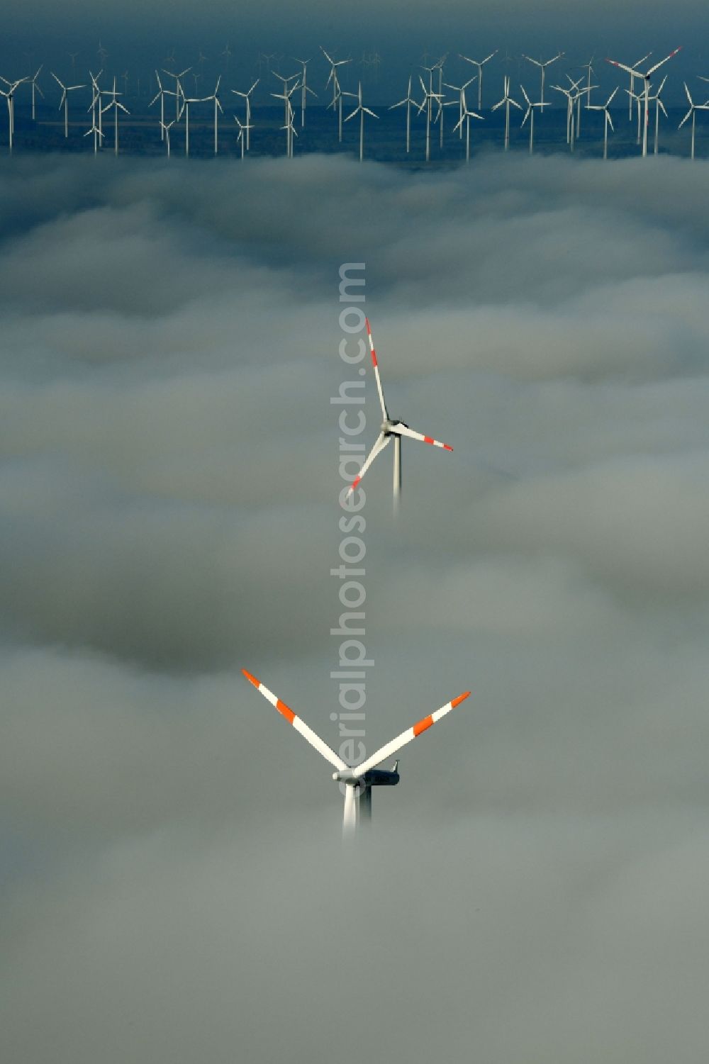 Waltersdorf from above - Weather-induced wind energy installations embedded in a fog layer on a field in Waltersdorf in the state Brandenburg, Germany