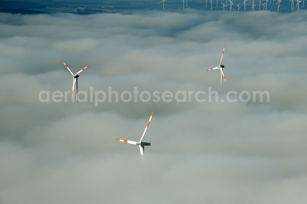 Aerial image Waltersdorf - Weather-induced wind energy installations embedded in a fog layer on a field in Waltersdorf in the state Brandenburg, Germany