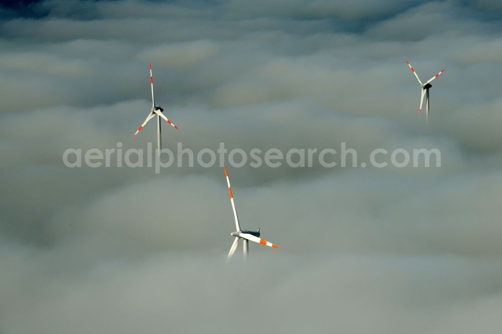 Aerial photograph Waltersdorf - Weather-induced wind energy installations embedded in a fog layer on a field in Waltersdorf in the state Brandenburg, Germany