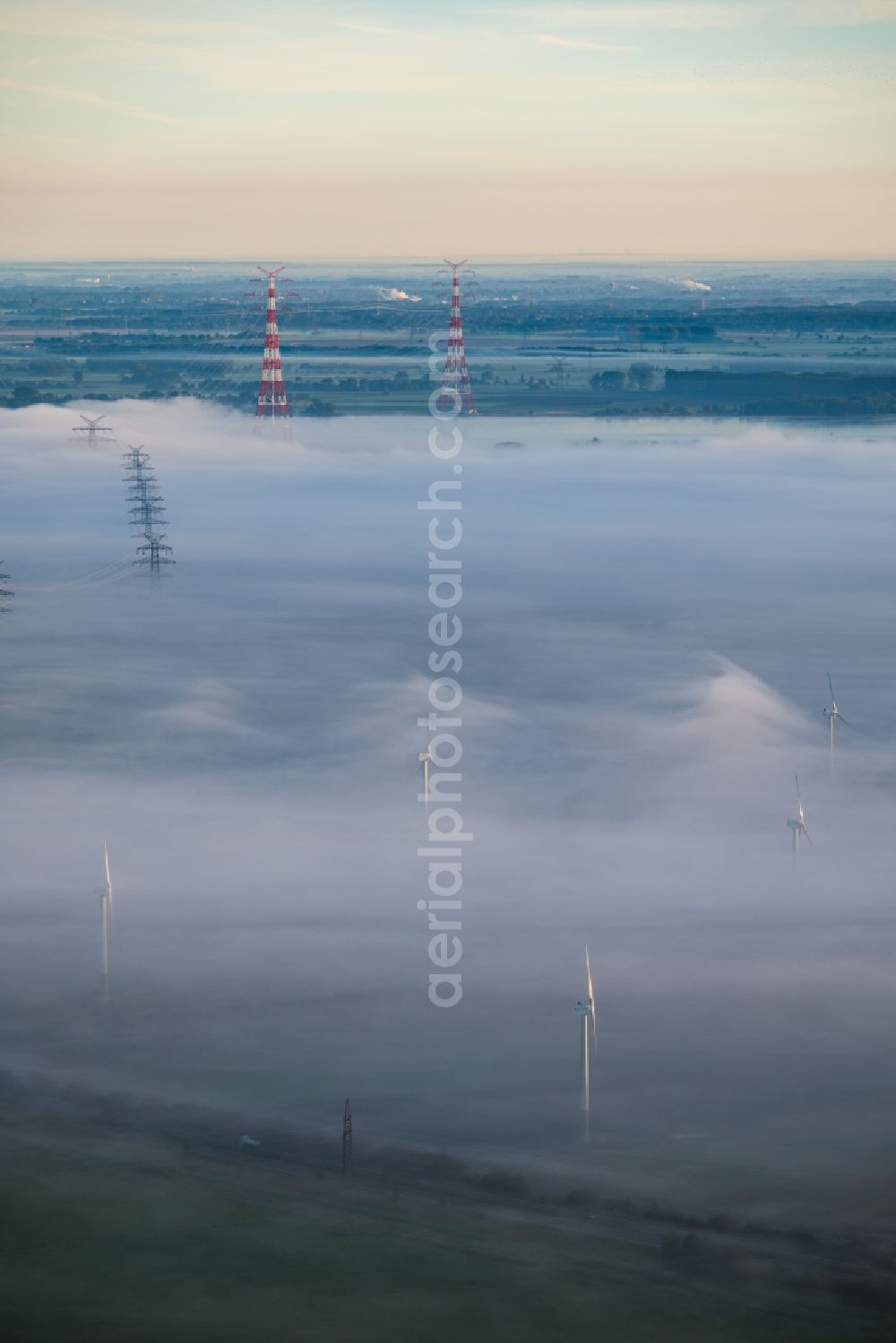 Aerial image Hollern-Twielenfleth - Weather-induced wind energy installations embedded in a fog layer in Hollern-Twielenfleth in the state Lower Saxony, Germany