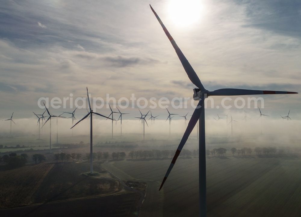 Aerial image Sieversdorf - Weather-induced wind energy installations embedded in a fog layer in Sieversdorf in the state Brandenburg, Germany