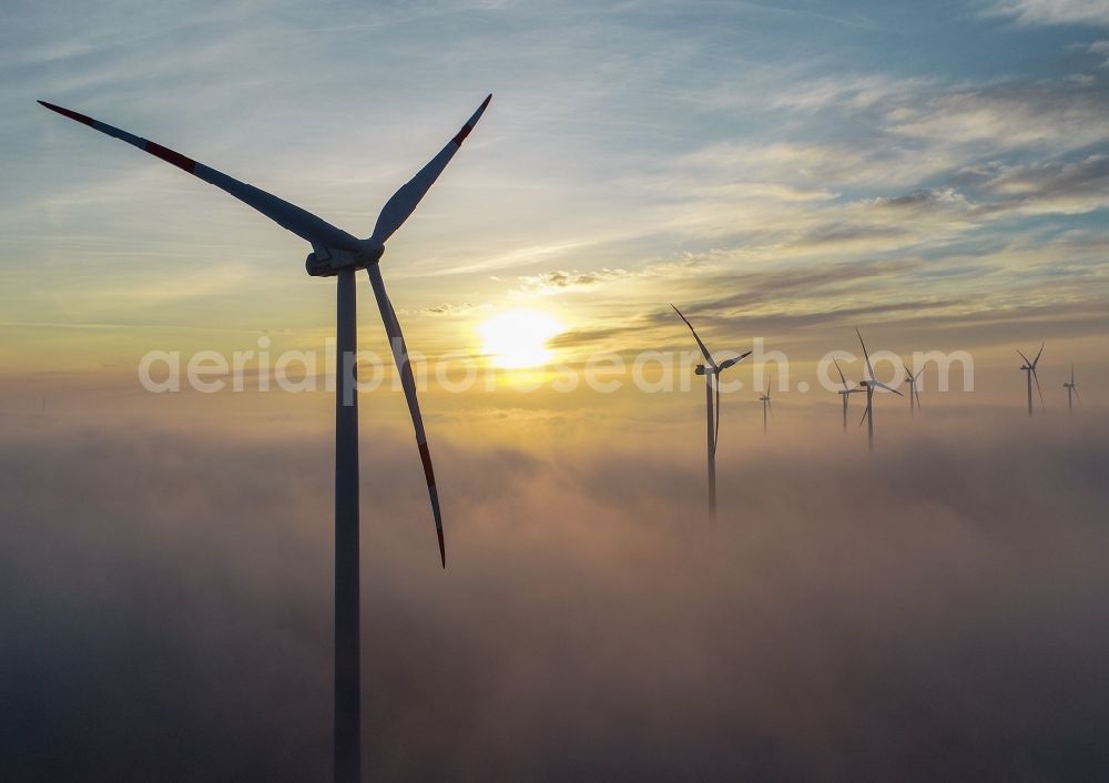 Sieversdorf from the bird's eye view: Weather-induced wind energy installations embedded in a fog layer in Sieversdorf in the state Brandenburg, Germany