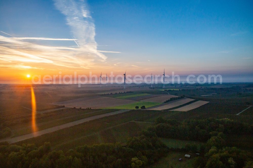 Dierbach from above - Weather-induced wind energy installations embedded in a fog layer of Windpark Freckenfeld bei Sonnenaufgang in Dierbach in the state Rhineland-Palatinate, Germany