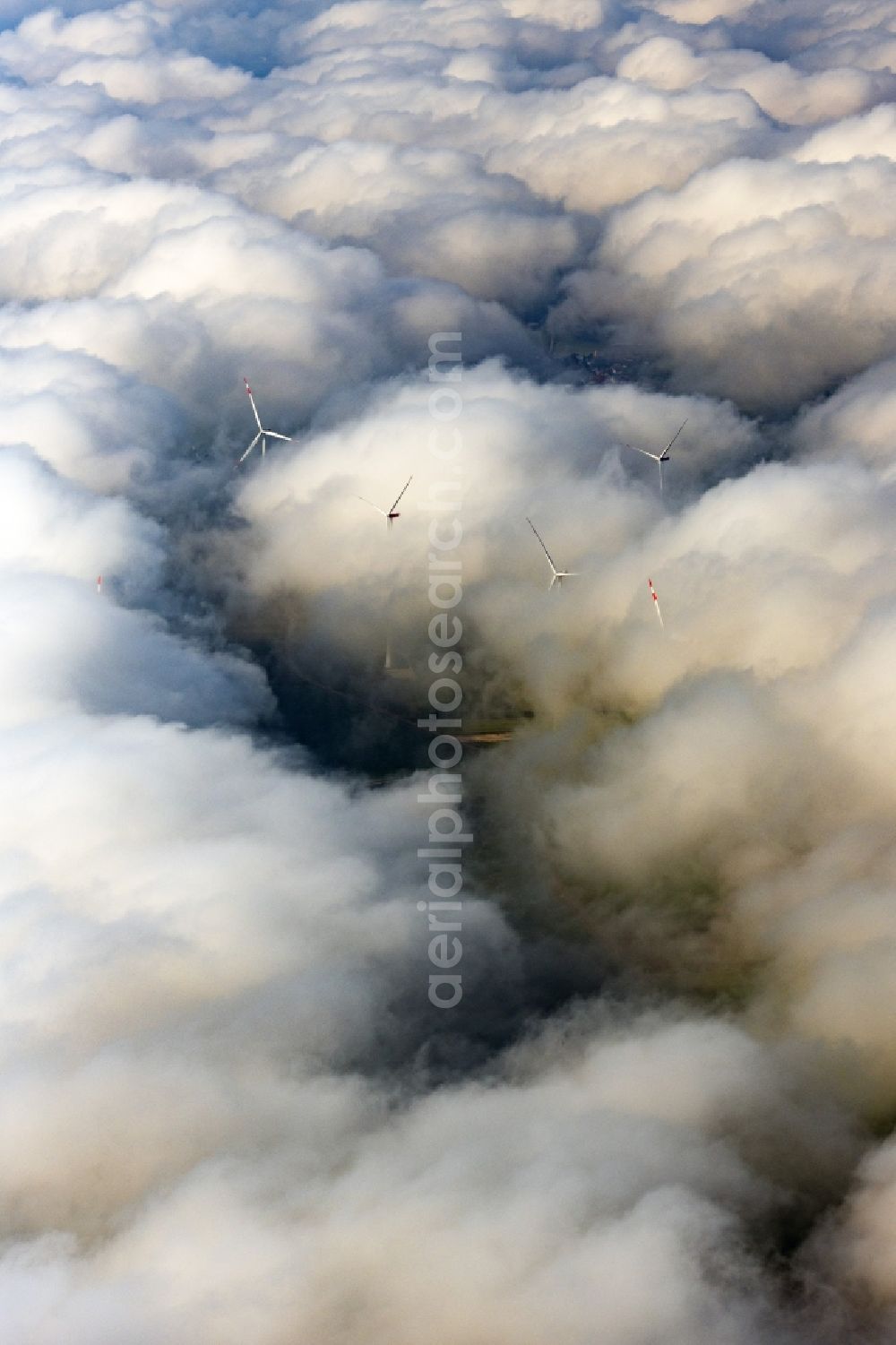 Flachslanden from above - Weather-induced wind energy installations embedded in a clouds layer in Flachslanden in the state Bavaria, Germany