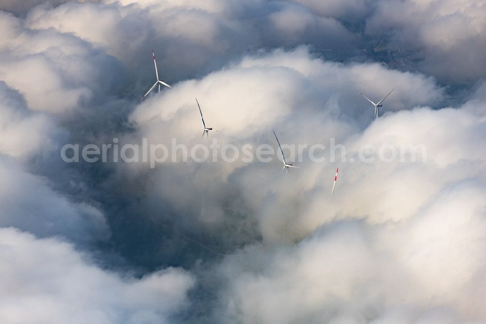 Flachslanden from the bird's eye view: Weather-induced wind energy installations embedded in a clouds layer in Flachslanden in the state Bavaria, Germany