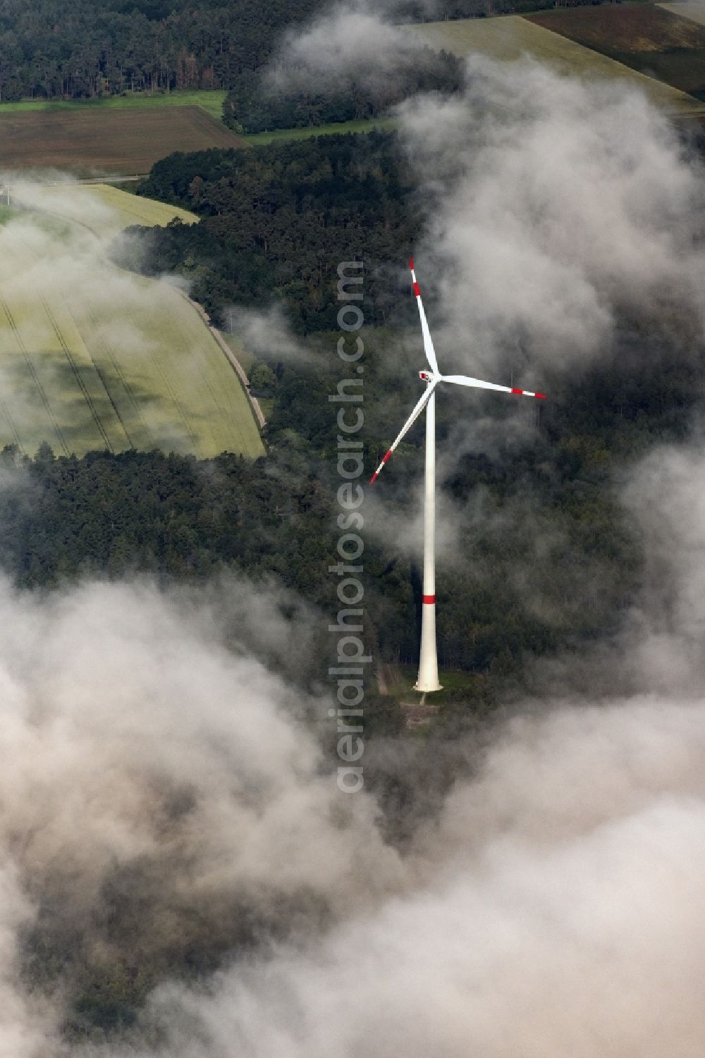 Aerial image Flachslanden - Weather-induced wind energy installations embedded in a clouds layer in Flachslanden in the state Bavaria, Germany