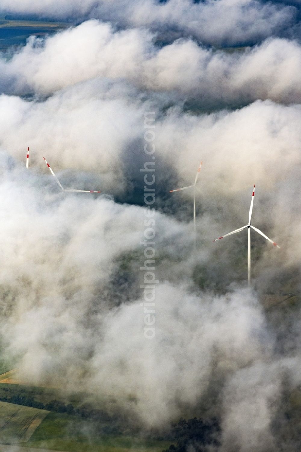 Aerial image Titting - Weather-induced wind energy installations embedded in a cloud layer in Titting in the state Bavaria, Germany