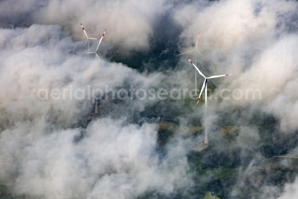 Aerial photograph Titting - Weather-induced wind energy installations embedded in a cloud layer in Titting in the state Bavaria, Germany